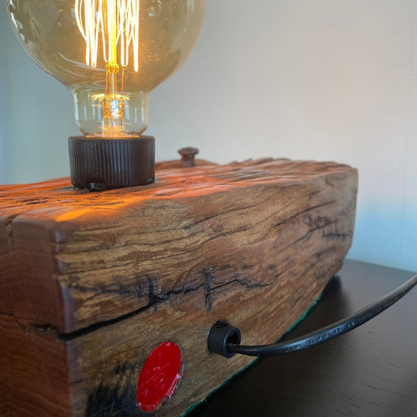 Upcycled wharf timber table lamp, handcrafted by shades at grays, back view of polished grain, black lead and makers brand.