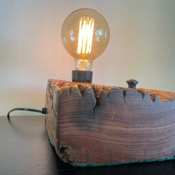 Upcycled wharf timber table lamp, handcrafted by shades at grays, side view of smooth end grain, polished with natural bees wax and black lead.