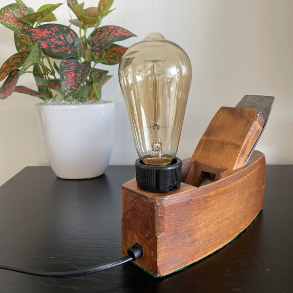 Authentic wood plane table lamp crafted by shades at grays, unlit.