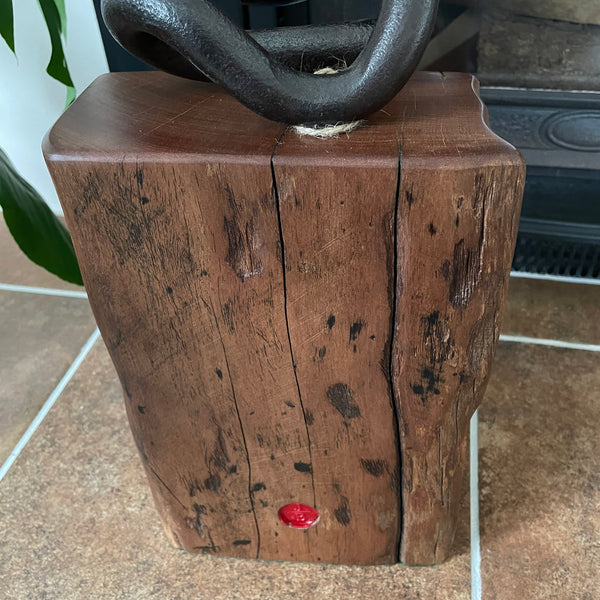 Wharf timber door stop with vintage railway iron, natural erosion grooves, upcycled by shades at grays, back view with makers red branding mark.