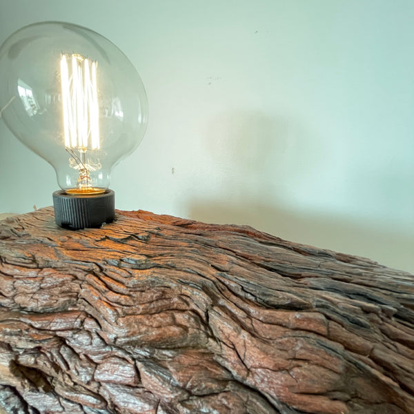 Wood table lamp handcrafted from eroded wharf timber, close up of grooves and edison bulb, by Shades at Grays