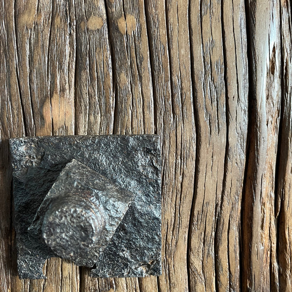 Original bolt retained on wharf timber lamp, close up.