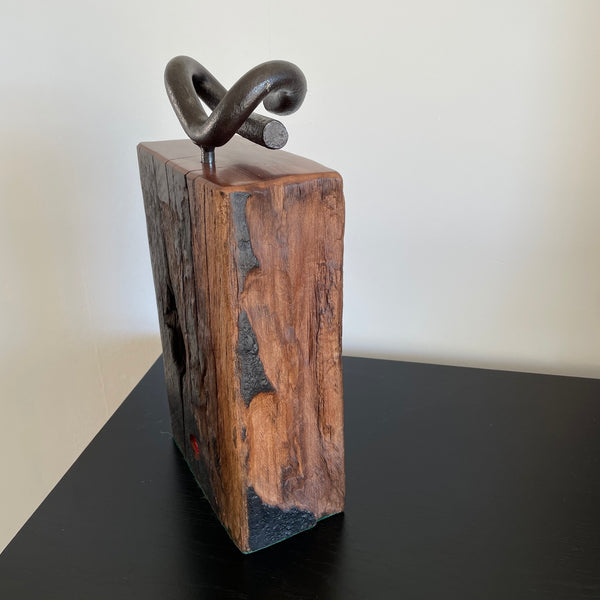 Wood door stop from reclaimed wharf timber and original railway iron by shades at grays, side view with original tar stains.