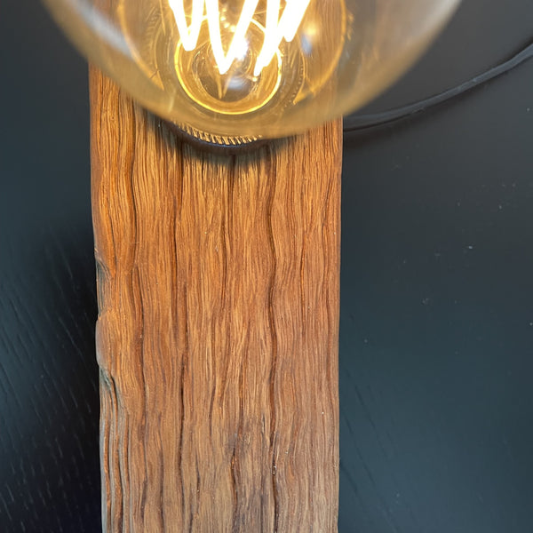 Wooden table lamp upcycled from old telegraph pole with edison bulb, top view, by shades at grays.