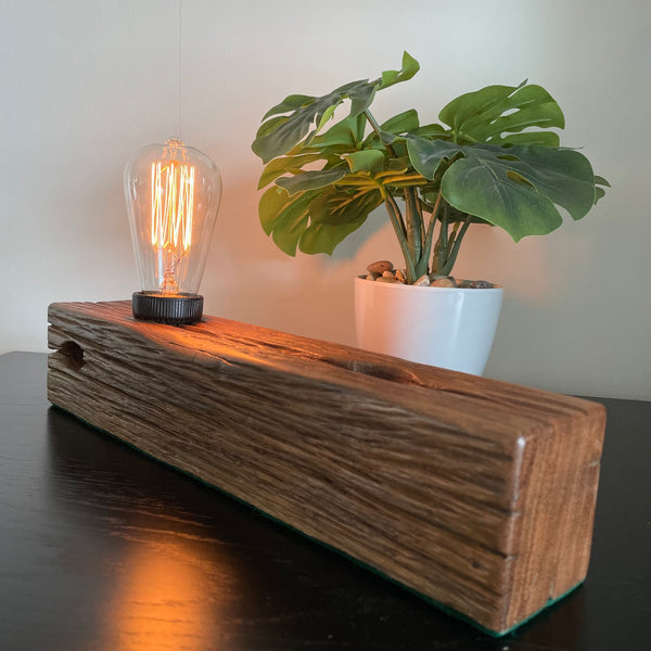 Wooden table lamp upcycled by shades at grays from old telegraph pole,smooth polished end grain.