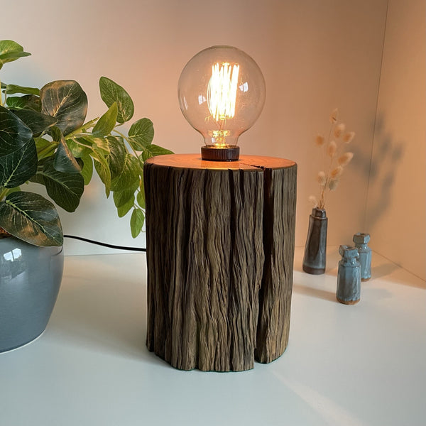 Wooden table lamp upcycled from authentic jarrah telegraph pole with edison bulb, lit with black lead.