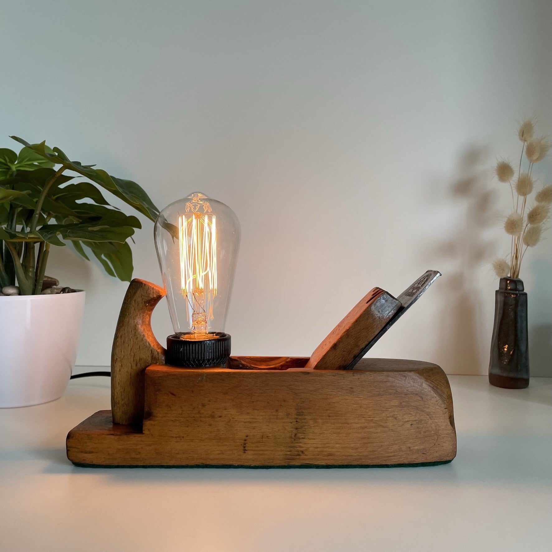 Wooden table lamp upcycled from vintage carpenters plane with edison bulb.