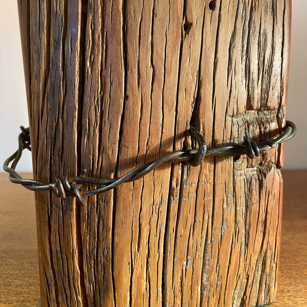 Wood table lamp, close up of polished grain and original wire by shades at grays.