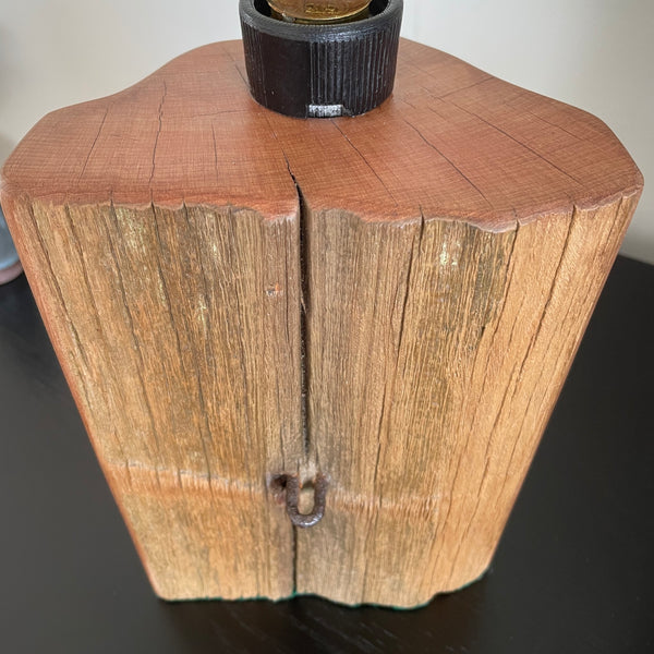 Wood table lamp crafted by shades at grays from old totara post with original staple, close up of front and top grain.