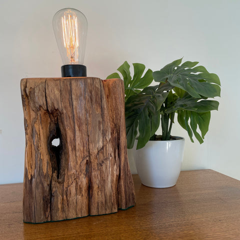 Wood table lamp handcrafted from eroded wharf timber, with edison bulb, front view, by shades at grays.