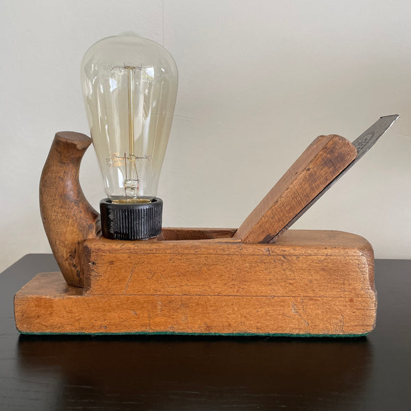 Wood table lamp made from vintage wood block with replica edison bulb, by shades at grays, front view, unlit
