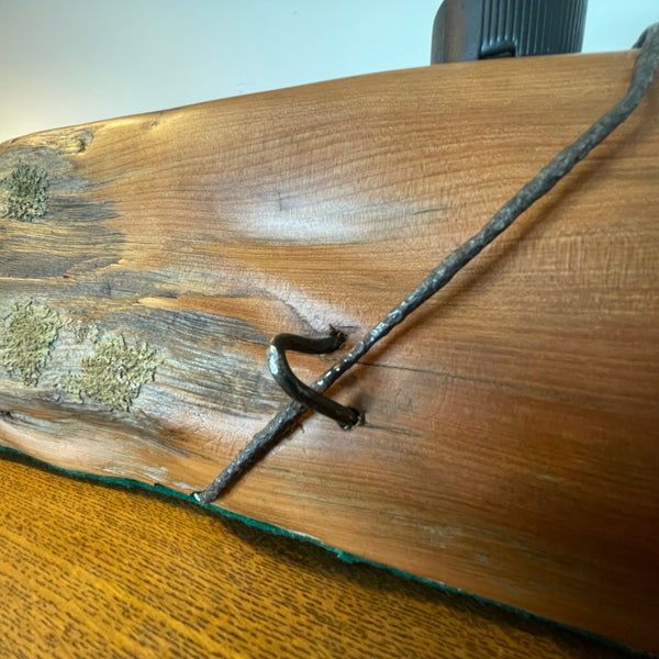 Wood table lamp reclaimed from vintage tōtara post close up of retained lichen and No8 wire and staple.