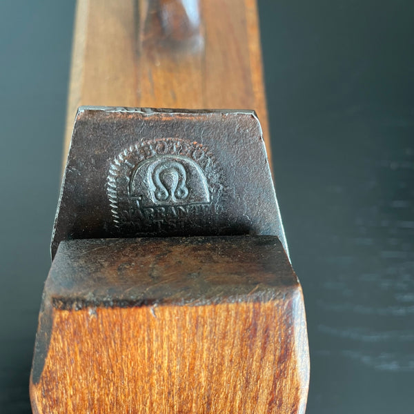 Wooden table lamp upcycled from authentic carpenter's plane close up of original brand on cutting steel.