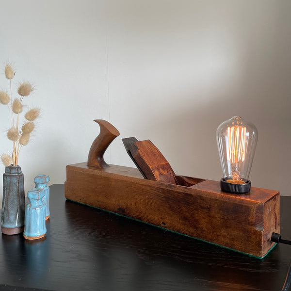 Wood table lamp upcycled from authentic half tote carpenter's plane, lit, crafted by shades at grays nz.