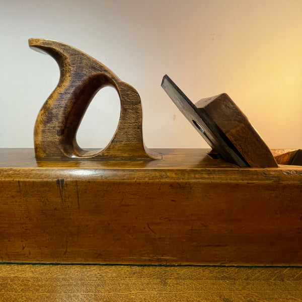 Wood table lamp upcycled from large carpenter's plane close up of mid section, polished with natural beeswax.