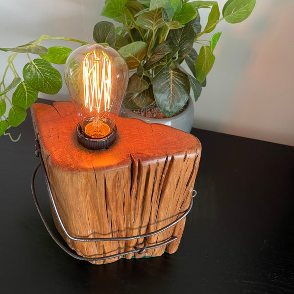 Wooden table lamp upcycled from old totara post by shades at grays beeswax polished smooth top.