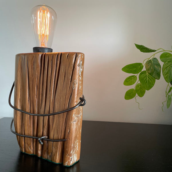 Wooden table lamp upcycled from old totara post by shades at grays with original wire, side view.