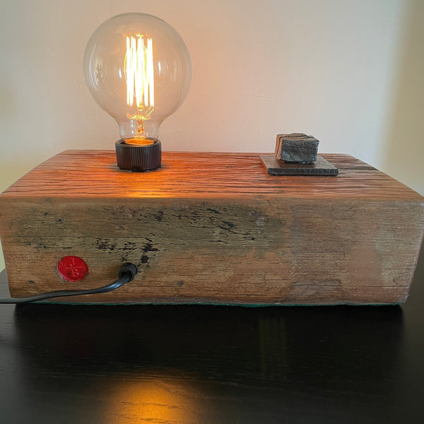 Wood table lamp upcycled from wharf timber with original bolt and edison bulb, back view, by shades at grays.