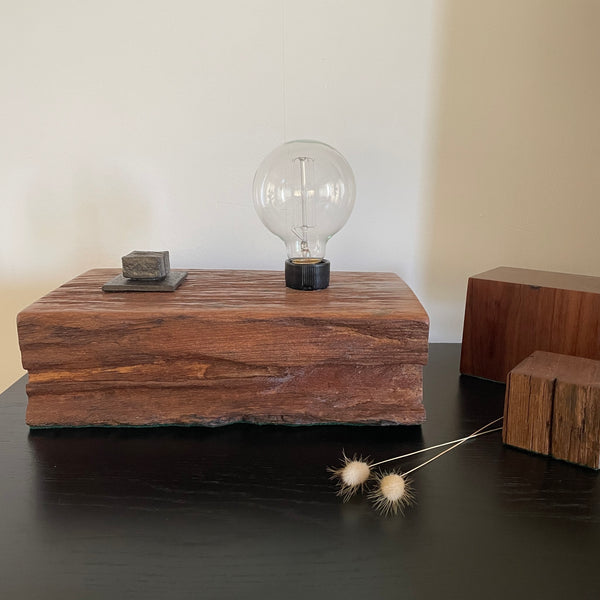 Wood table lamp upcycled from wharf timber with original bolt and edison bulb, unlit, by shades at grays.