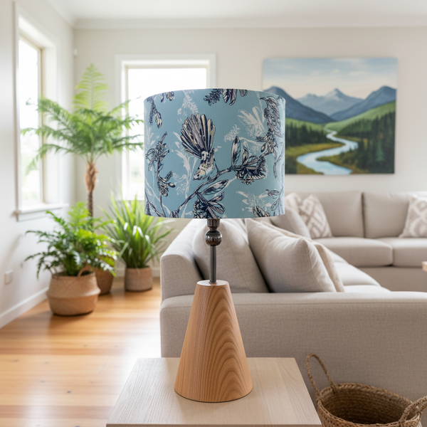Blue Fantail lampshade on timber base in NZ living room
