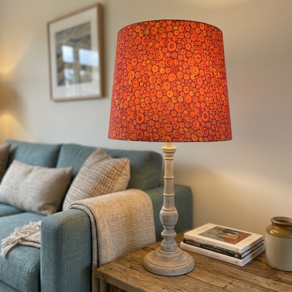 Button Mosaic Orange tapered lampshade in a living room