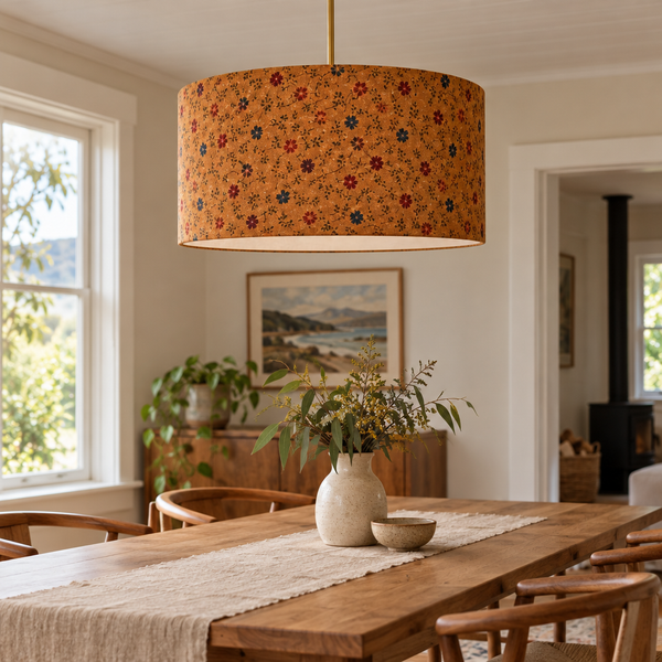 Cornflower fabric on a barrel pendant in a dining area