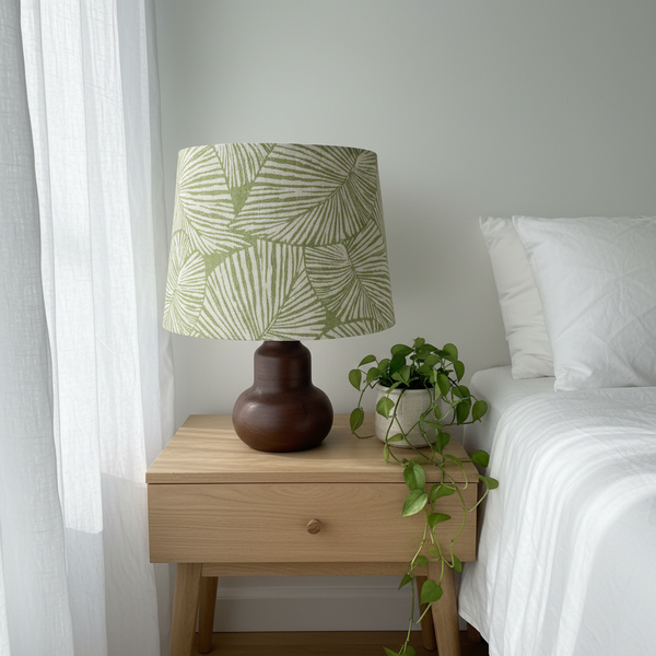 Green Palms lampshade on ceramic base in botanical bedroom