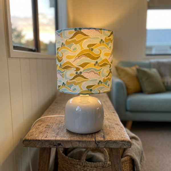 Illuminated Hills and Trees lamp in a cosy holiday-home sitting room