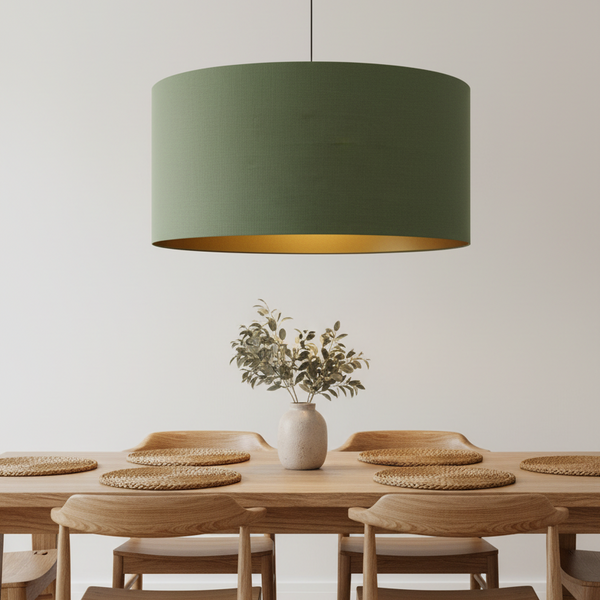 Kale green linen barrel ceiling pendant lampshade over wooden dining table