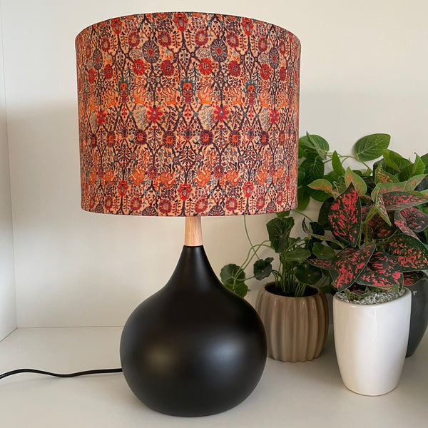 Black touch lamp with handcrafted fabric lamp shade, unlit.