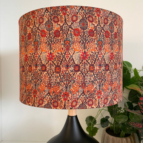 Close up of  handcrafted fabric lamp shade, on black touch lamp unlit.