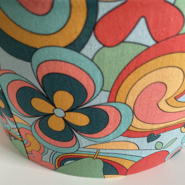 Close up of multi-coloured medium fabric lamp shade in 60's style.