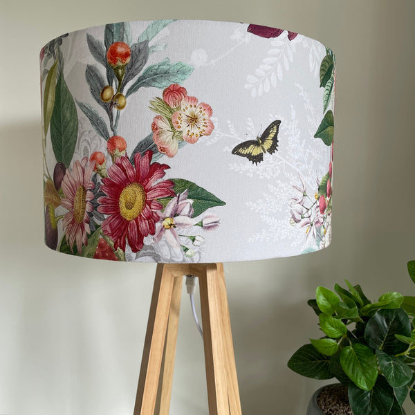 Contemporary natural wood table lamp with handcrafted fabric lampshade, unlit..