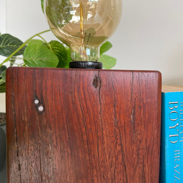 Chocolate brown jarrah wood table lamp, handcrafted from old telegraph post with added edison light bulb. Second of two.