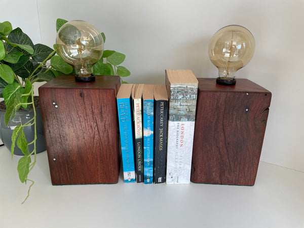 Handcrafted pair of wood lamp book ends or bedside table lamps, unlit.