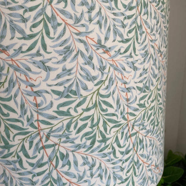 Close up of large drum hand crafted lamp shade in William Morris Willow and Boughs Cream fabric, unlit.