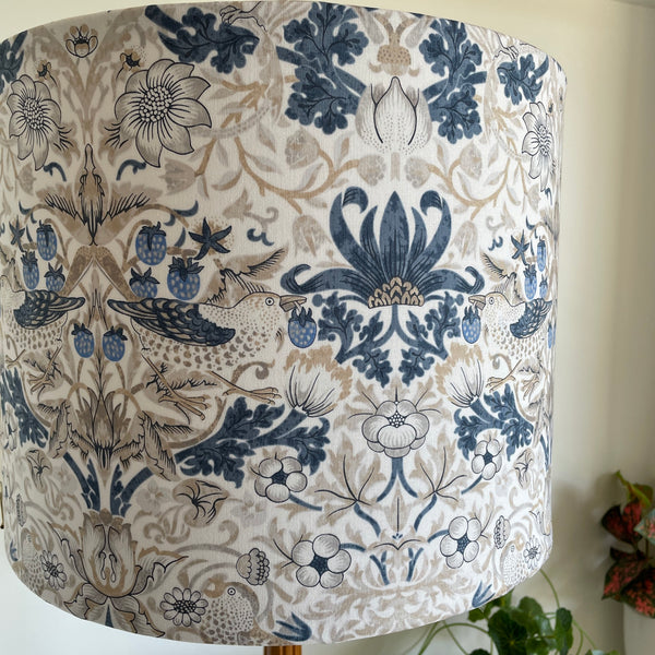 Large drum handcrafted lamp shade with William Morris fabric, unlit, mid view..