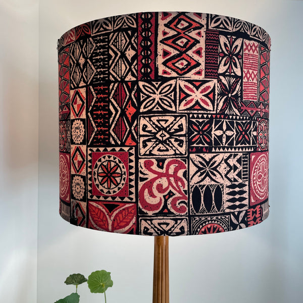 Large drum fabric lamp shade with Pacific style tapa design fabric.