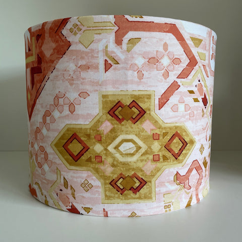 Large gold geometric pattern on handcrafted lamp shade, unlit.