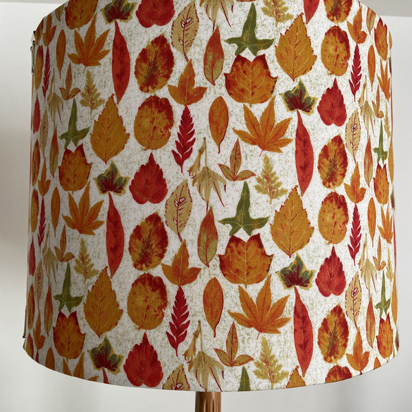 Large handcrafted fabric lamp shade with autumn leaves fabric, unlit.