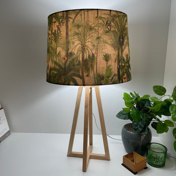 Modern wood table lamp with handcrafted lamp shade, lit