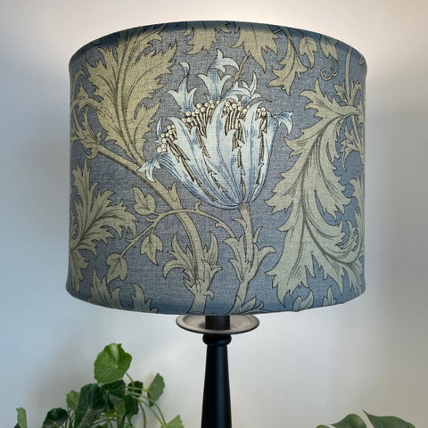 Blue and sage green floral and leave pattern. Morris and Co Anemone light blue. Bespoke fabric lampshade. Lit