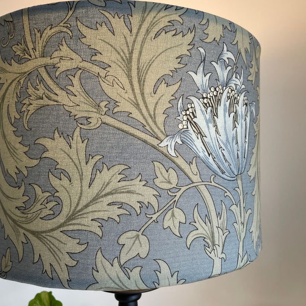 Large drum fabric lampshade. Blue and sage green floral and leave pattern. Morris and Co Anemone light blue. Bespoke fabric lampshade. Lit