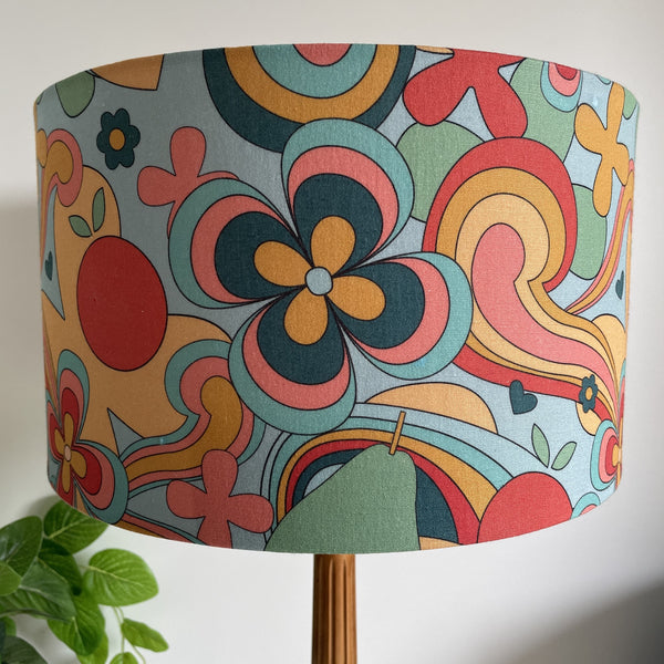 Multi-coloured medium fabric lamp shade in 60's style, unlit.