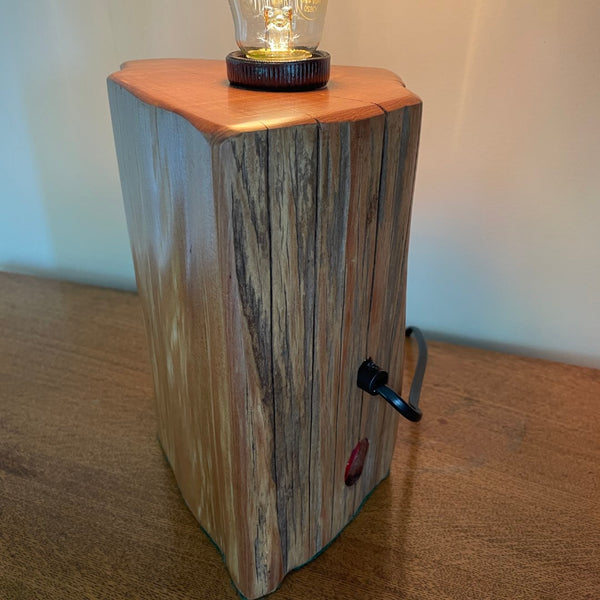 Back of unique timber table lamp handcrafted in New Zealand from old totara post. Black lead.