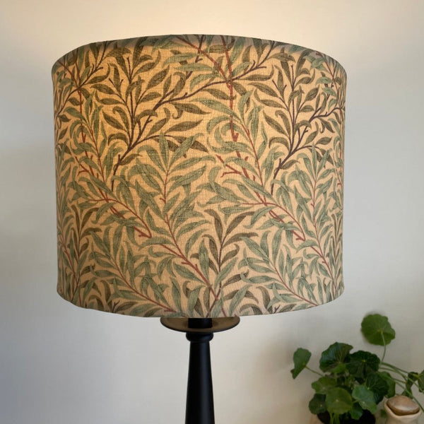Shades at Grays Bespoke large drum lampshade with Morris & Co Willow Boughs - Sage Green. Lit. Straight sided and tapered light shades made to order.