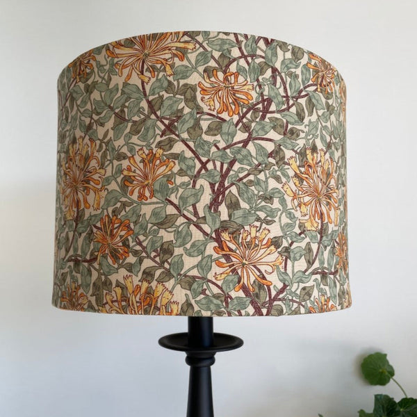 Shades at Grays bespoke fabric lampshade in Morris & Co honeysuckle sage green fabric. Unlit. Mid view