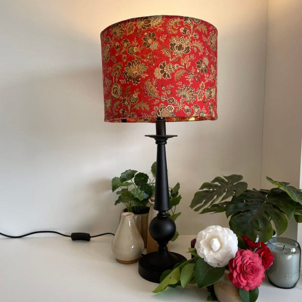Shades at Grays bespoke large fabric lampshade, French General Lavigne Rouge fabric. Lit, long view on tall black stannd.