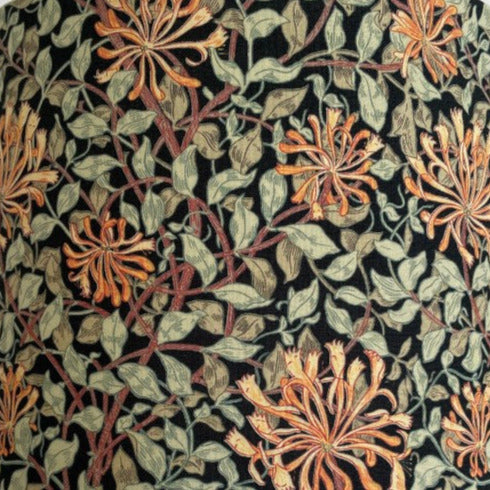 Close up of  Morris & Co honeysuckle black fabric