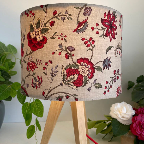 Shades at Grays medium drum fabric lampshade with French General Blanchet Roche fabric. Lit on timber table lamp stand.